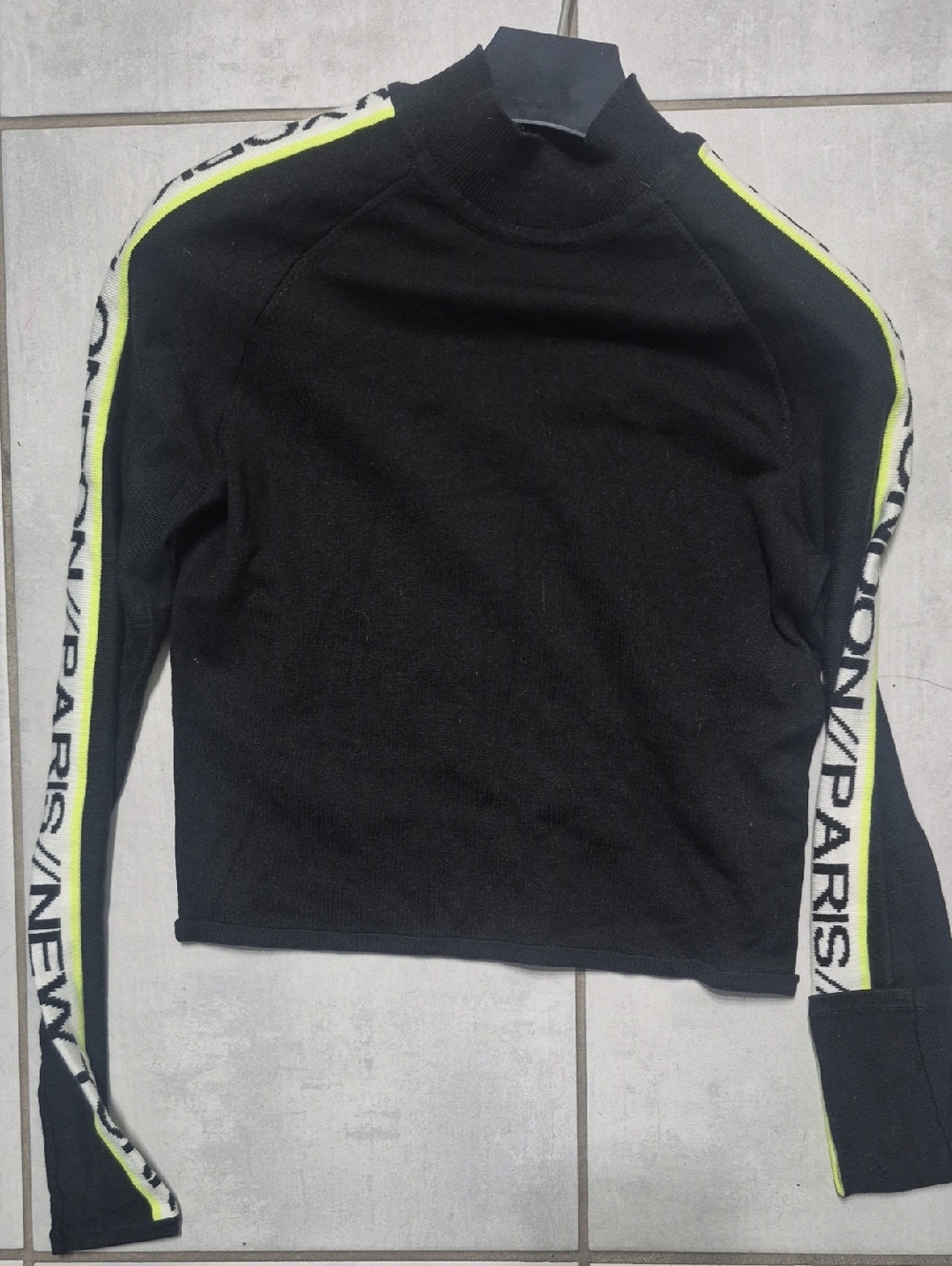 H&M Black Turtleneck Sweater with Neon Yellow Stripe and White Sleeve Text